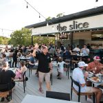 The Slice's new rooftop brings the pizzeria’s capacity to nearly 150, offering a with a mix of high-top and standard seating. (Photo/The Slice)